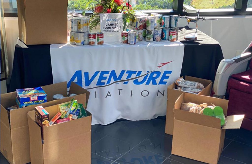 Boxes of canned food donations inside Aventure Aviation's Atlanta headquarters