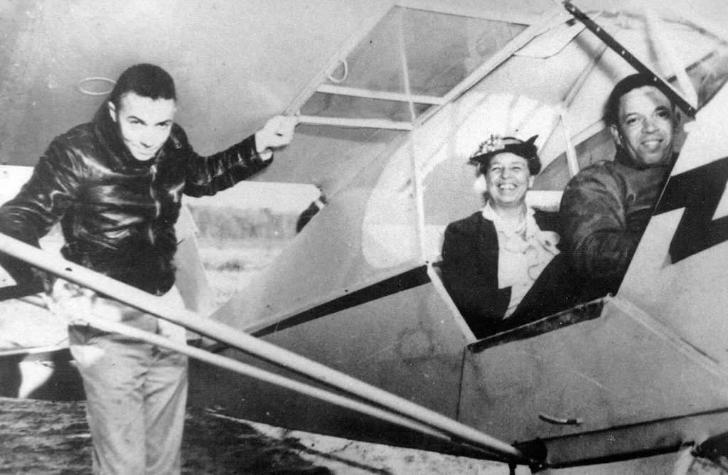 March 1941 – U.S. Army Air Corps Tuskegee Airman pilot Alfred Anderson (right) with First Lady Eleanor Roosevelt (center).