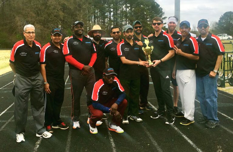 The Aventure Aviation Flyers cricket team with their newly won trophy.