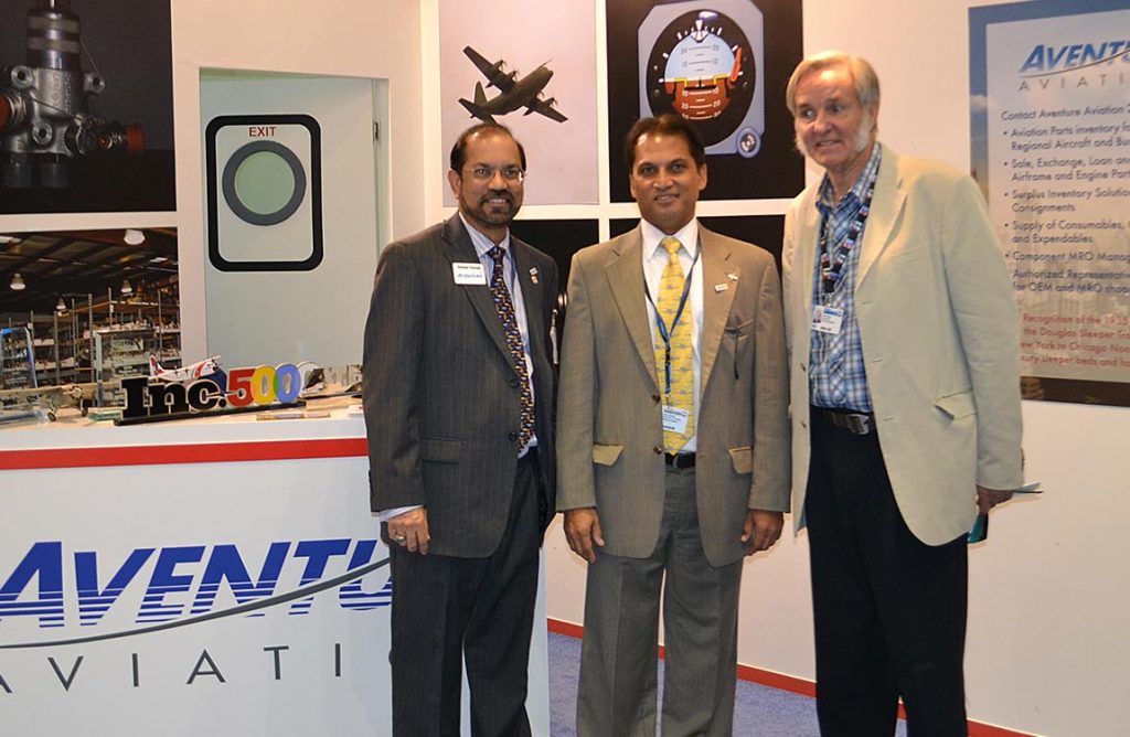 Aerospace designer Burt Rutan visits Aventure team members Zaheer Faruqi and Amyr Qureshi at the Aventure Aviation booth at the 2011 Dubai Airshow