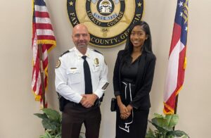 Sheriff Barry Babb with Aventure office manager, Chelsea Griffin.