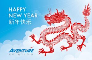 "Happy New Year 新年快乐 – Aventure Aviation" Illustration of a red dragon over a cloud in the sky