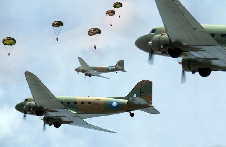 Three World War 2 cargo aircraft in the sky launching paratroopers with parachutes